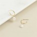 Natural freshwater pearl teardrop earrings, available in gold, silver, and rose gold.