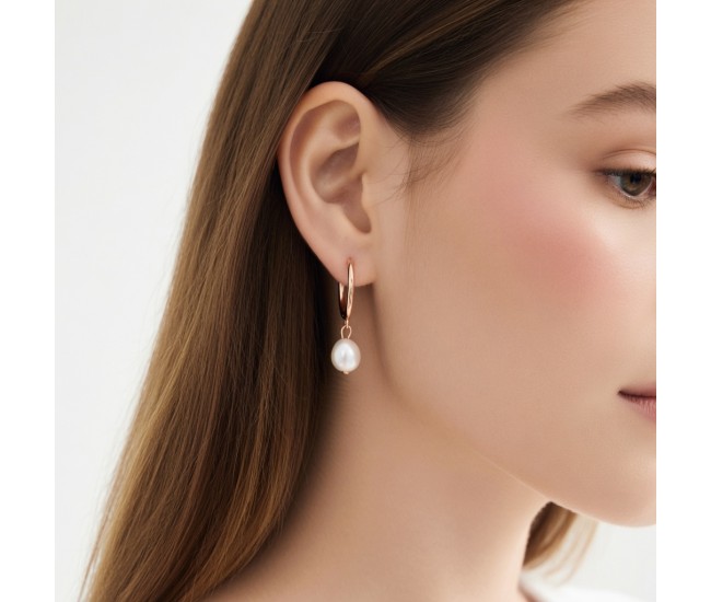 Natural freshwater pearl teardrop earrings, available in gold, silver, and rose gold.