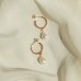 Natural freshwater pearl teardrop earrings, available in gold, silver, and rose gold.